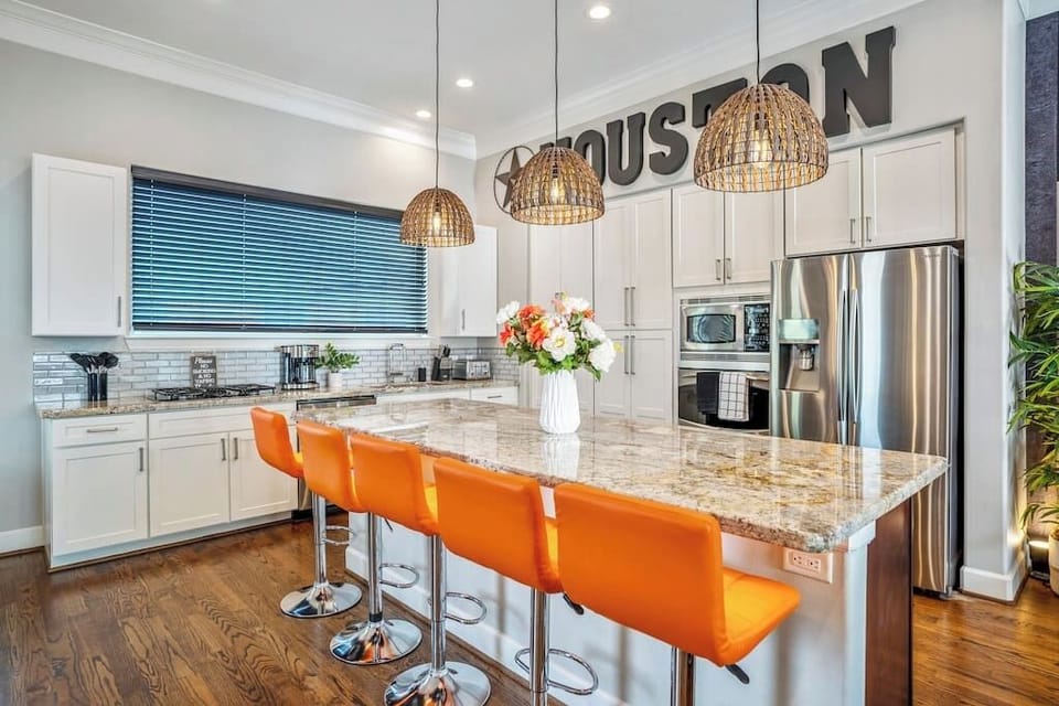 Very large kitchen island with barstool seating for 5 and a fully stocked kitchen with place setting for 16 people - kitchen has all the amenities needed for your entertaining needs