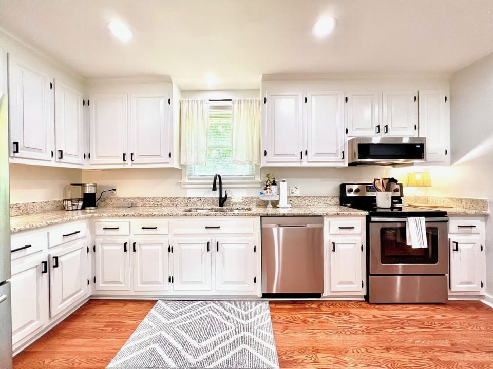 Updated kitchen with stainless steel appliances and everything needed for easy meals
