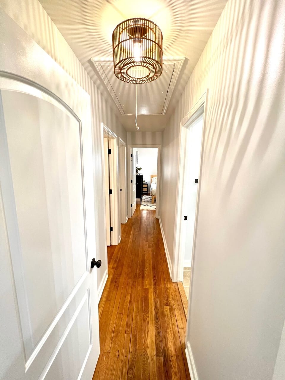 Hallway from kitchen towards bedrooms has a door to help make nap time quieter. 
