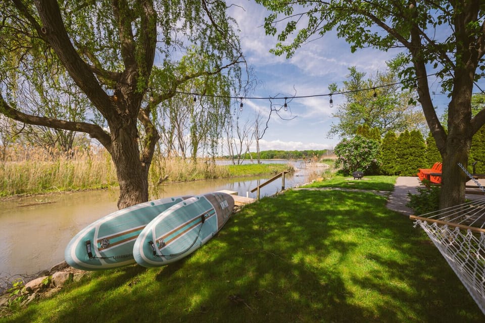 Enjoy a backyard dock, firepit, and patio - perfect for launching our paddle boards, or your kayak or canoe.