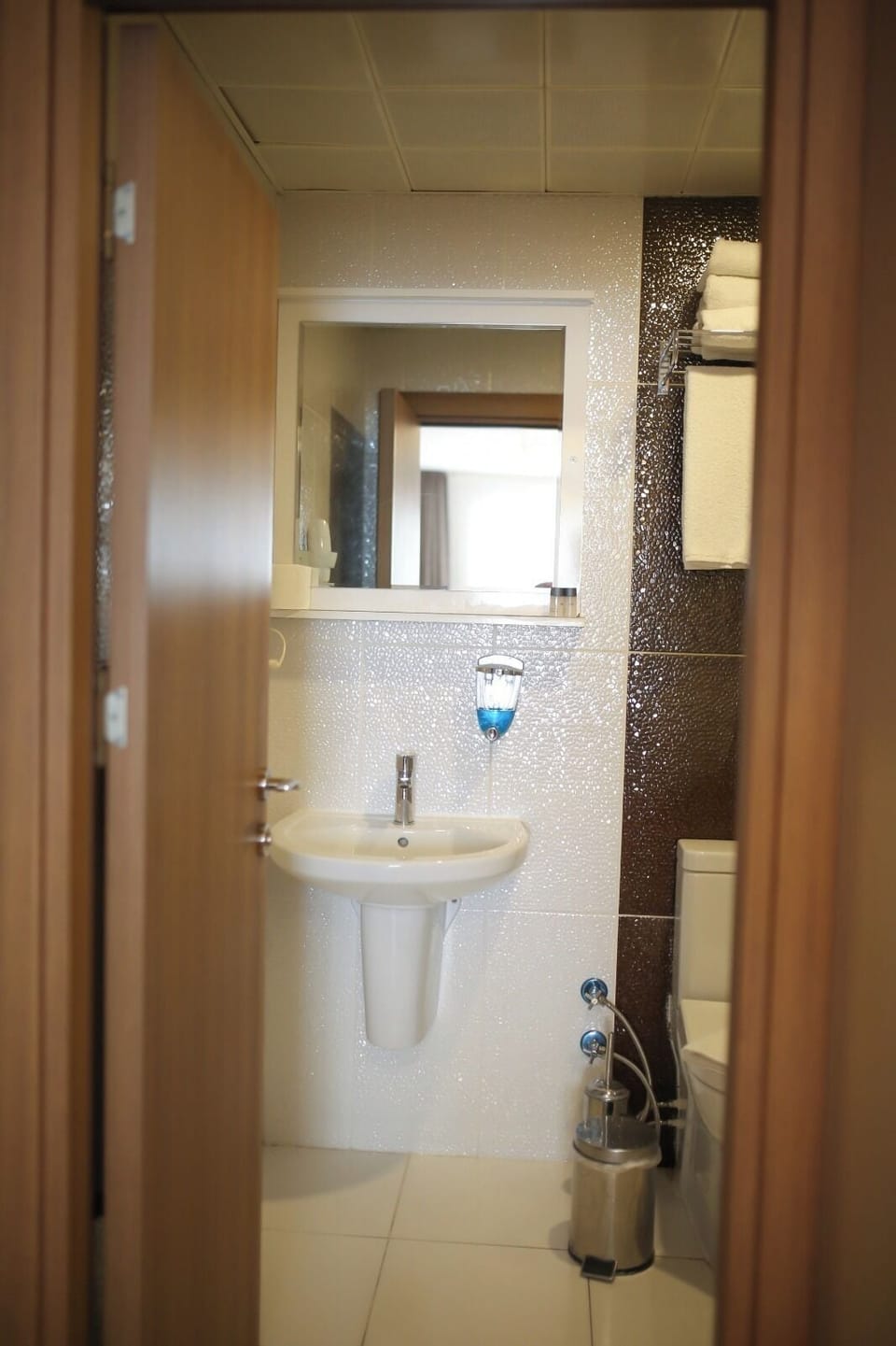Shower, hair dryer, slippers, towels