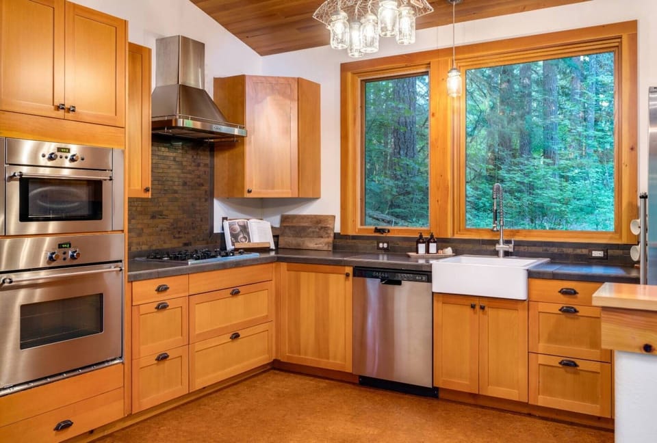 "Inside was very comfortable with great views of the forest and the creek. Kitchen was great.  Loved our stay and will definitely return." - Chris
