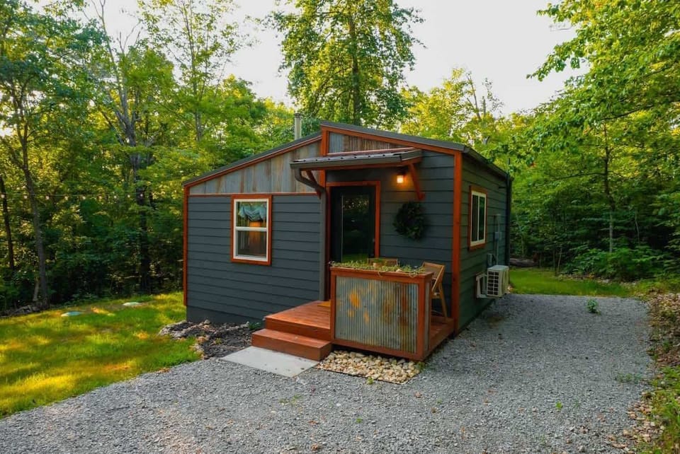 🌲✨ Nestled in the Ozarks, our tiny wood‑clad cabin invites you to unwind amid towering trees.