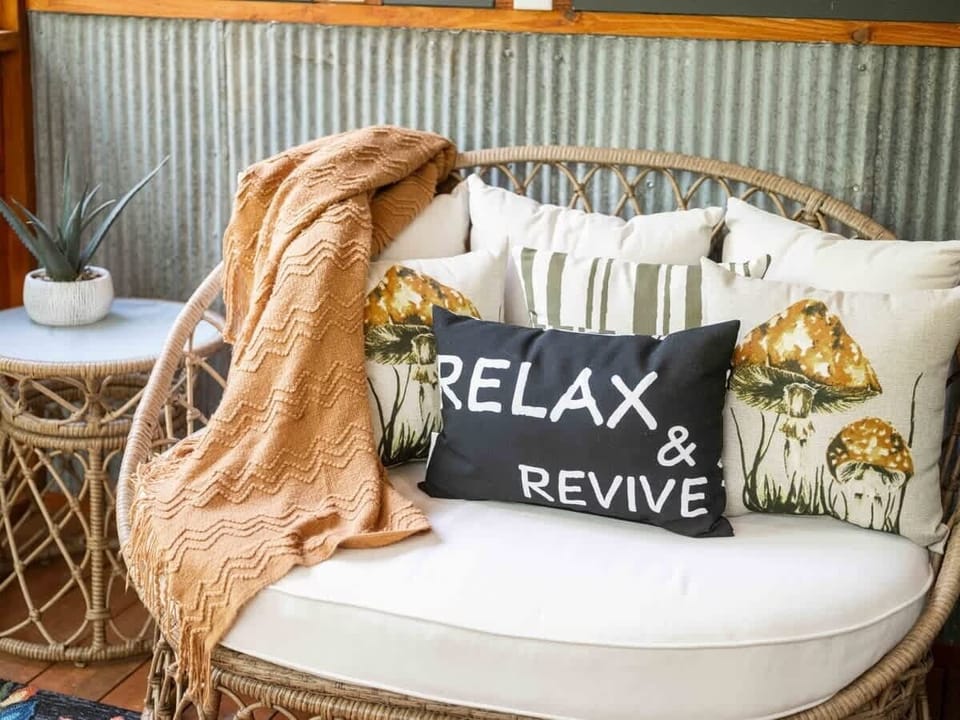 😌🛋️ Sink into plush porch seating and let nature revive your senses.