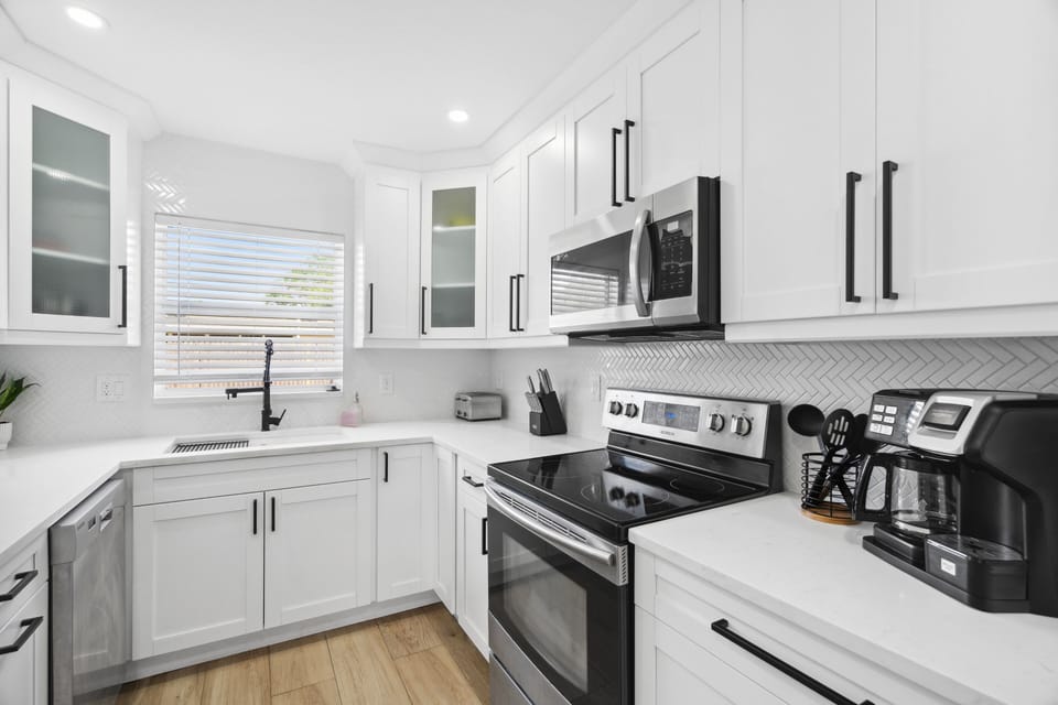 Fully equipped kitchen with stainless appliances and plenty of counter space.