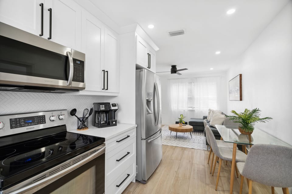 Fully stocked kitchen with stainless appliances and space to cook together.