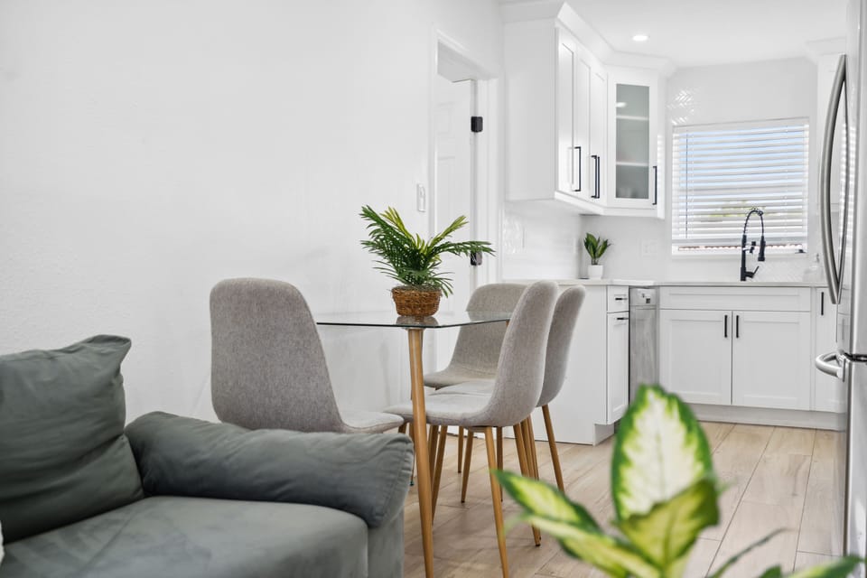 Dining area with seating for four — great for meals, coffee, or working on the go.