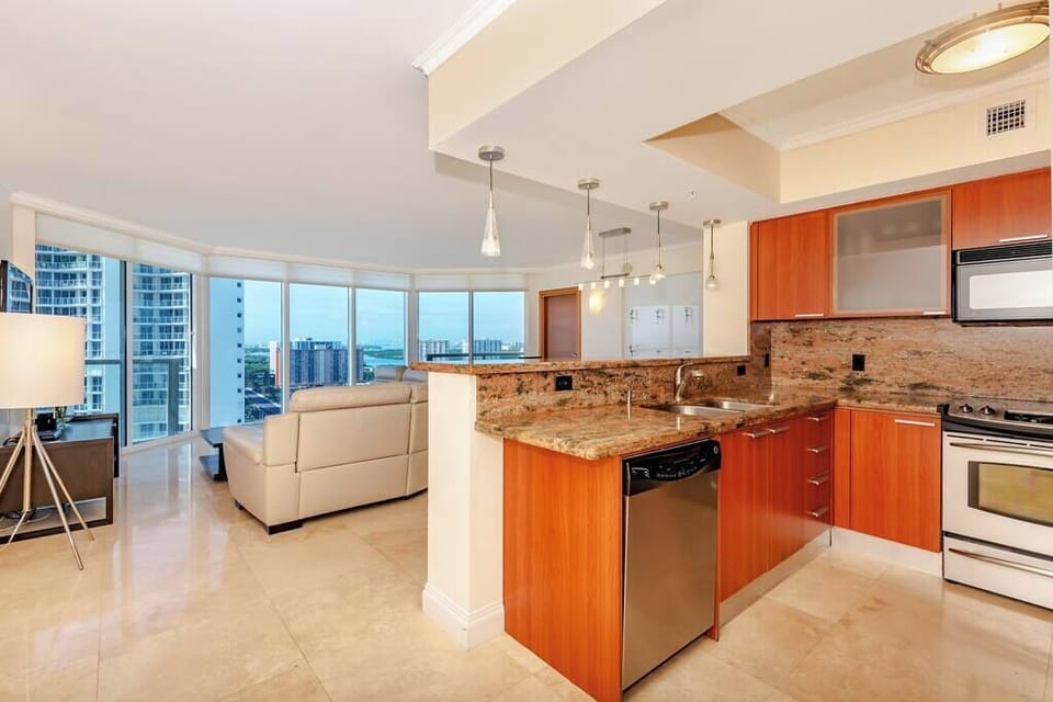 Ocean and city views from kitchen! Updated countertops from other units in the building. Fully equipped for all your cooking needs.