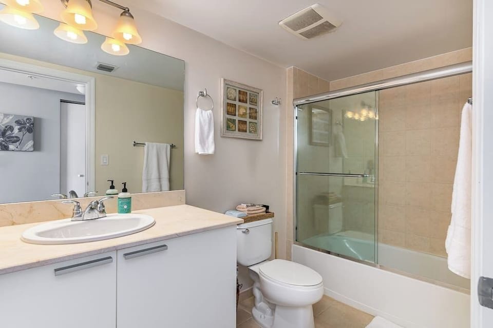 Second bathroom featuring a relaxing bathtub.