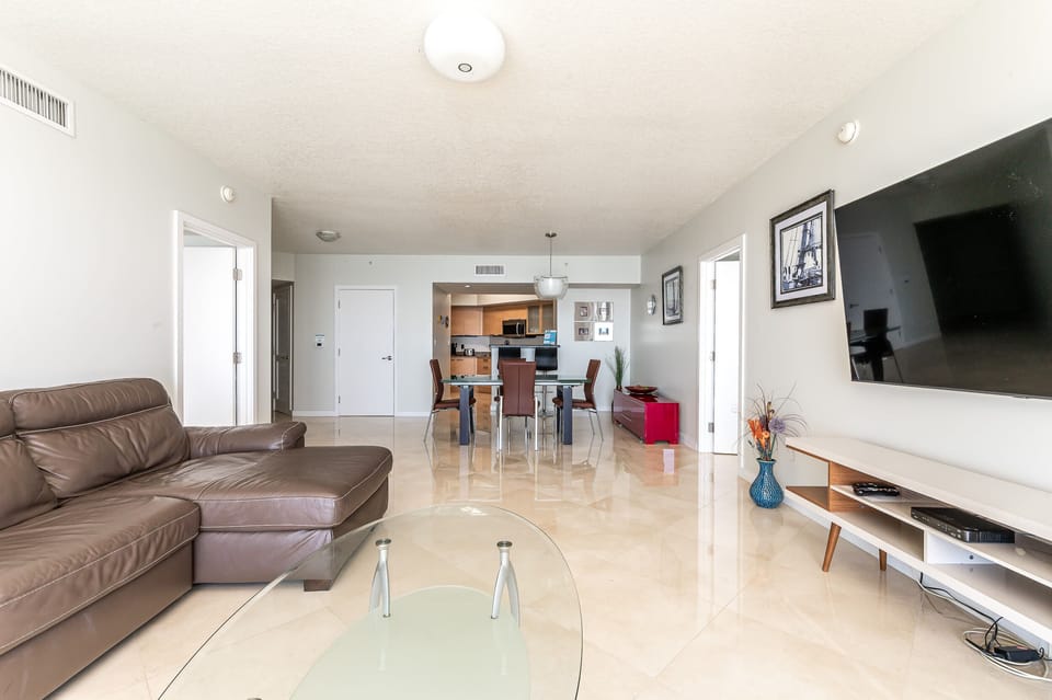 Living room - 75" TV - ocean views - marble floors.