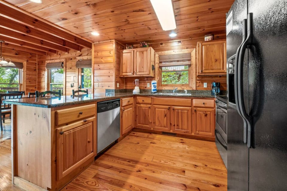 Kitchen includes a dishwasher, oven, microwave, full-sized refrigerator and a standard coffee maker.