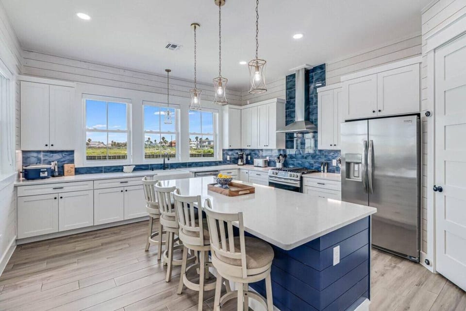 Whip up vacation meals in this fully equipped kitchen with a splash of seaside style.