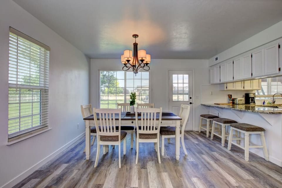 Bright Dining area with bar stools