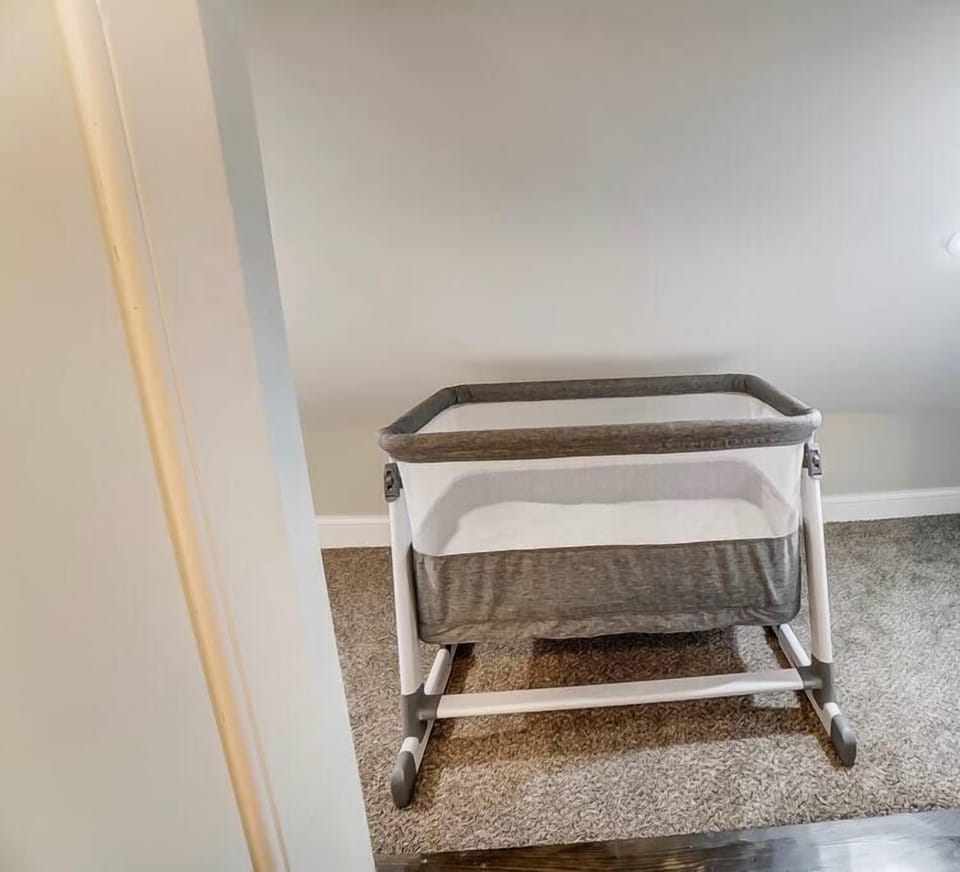 Bedroom 4: Crib, games, fans and more present