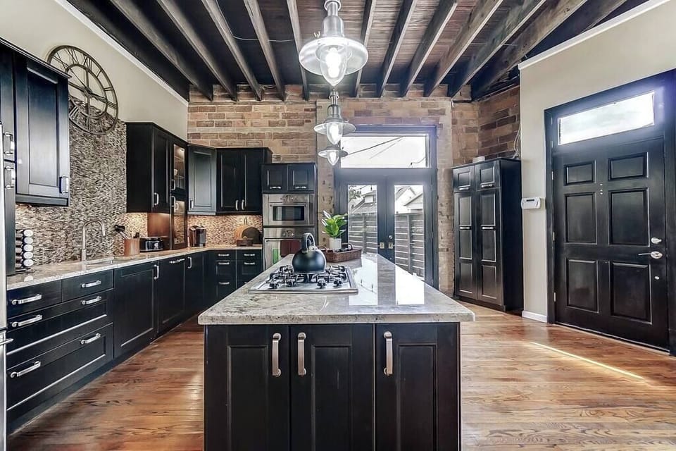 This upscale modern kitchen is fully equipped for hosting dinners and holidays.  Has access to backyard patio