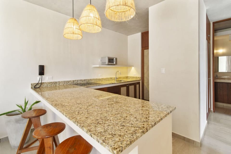 Inviting dining area with warm Tulum vibes—perfect for every meal.