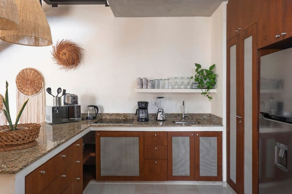 Open kitchen with lots of counter space and all essential appliances.