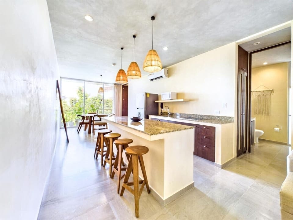 Fully equipped kitchen with stove and microwave for easy cooking.