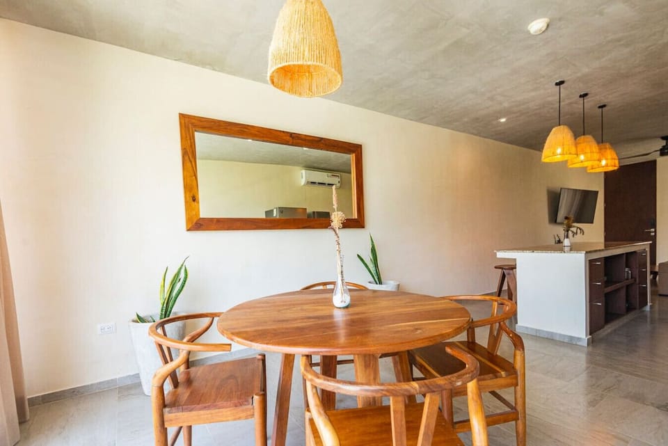 Open living space with kitchen, dining area & lots of natural light.