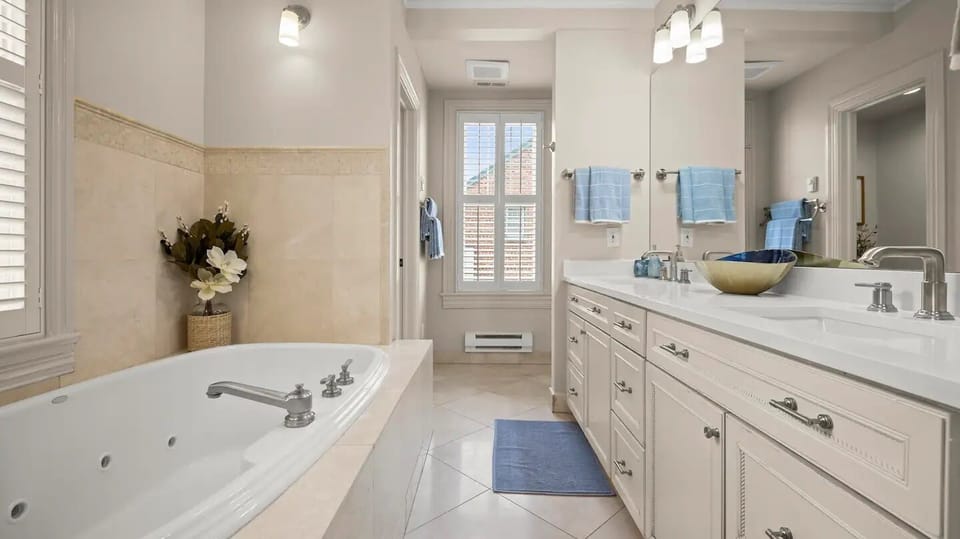 Modern and spacious bathroom featuring a sleek tub.