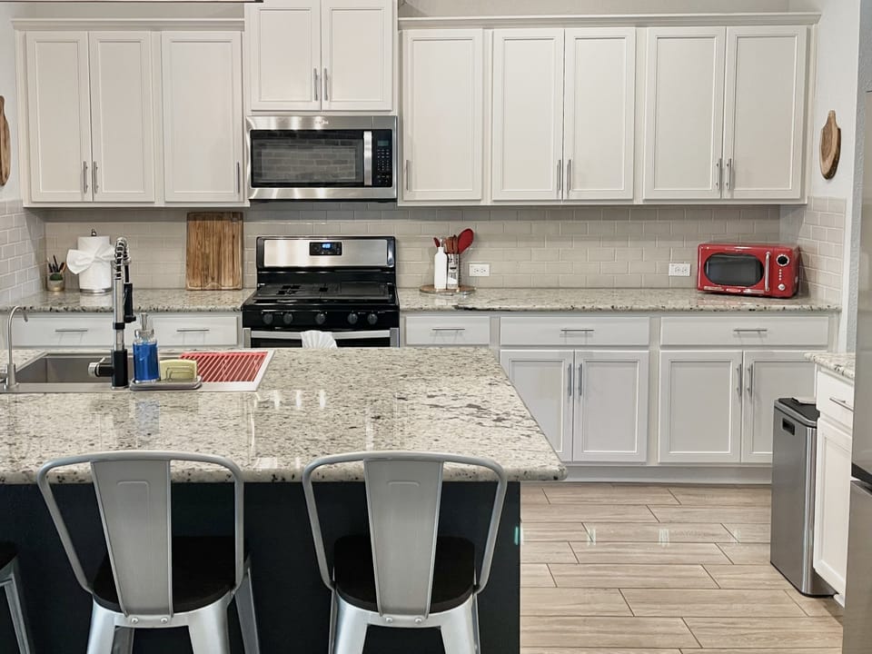 fully equipped kitchen with utensils and small appliances 