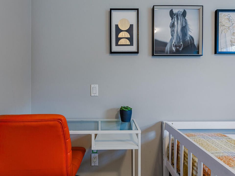 A bright and functional workspace accented with modern décor — ideal for catching up on work, journaling, or planning your next day of exploring Vancouver.