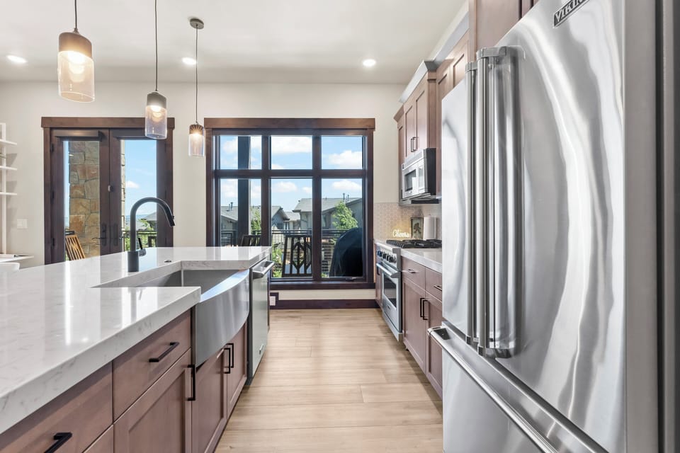 Stylish kitchen with a large island, stainless steel appliances, and plenty of space for cooking and gathering.
