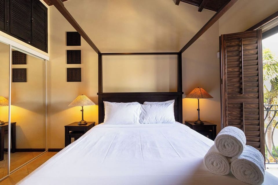 Escape to serenity: Unplug and unwind in this peaceful haven of a bedroom.