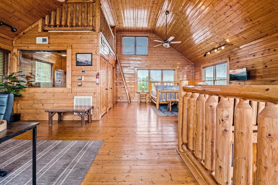 Upper-level loft with king bed, working space, queen sofa bed, and crow's nest