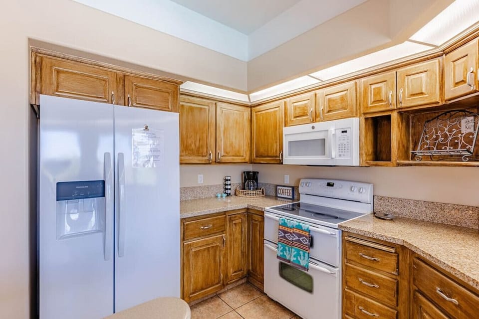 Fully equipped kitchen with modern appliances.