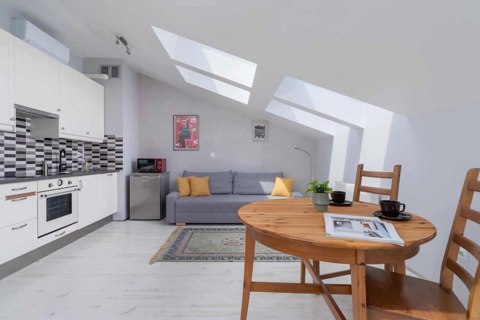 Kitchen and dining space in a modern style with easy access to the living area.

