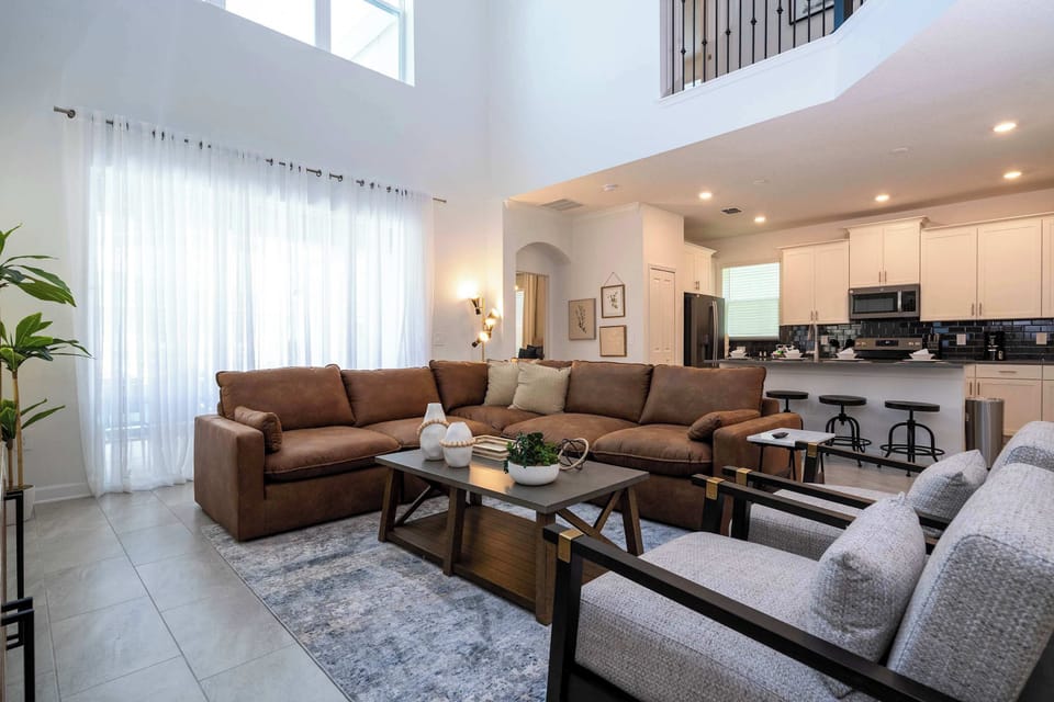 Sink into the plush leather sectional in our spacious living room. It's the ultimate spot for family movie nights or relaxing after a busy day.