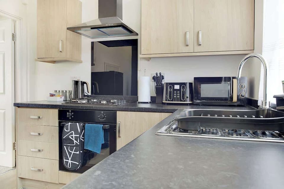 Fully equipped kitchen with everything you need to prepare meals during your stay.