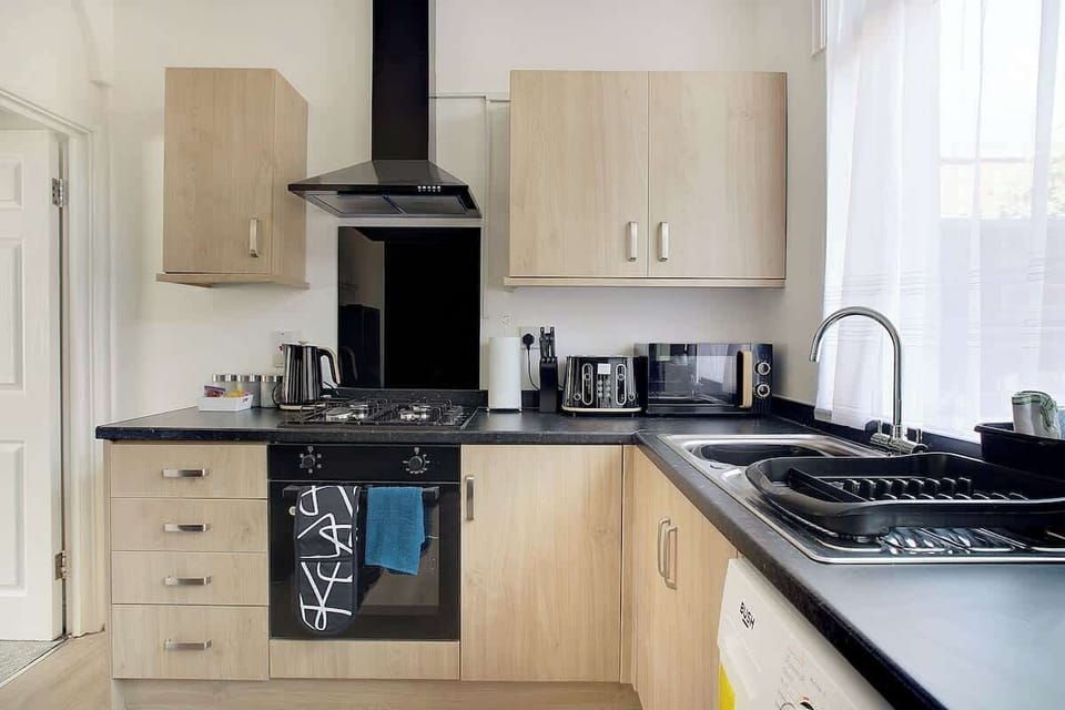 Fully equipped kitchen with everything you need to prepare meals during your stay.