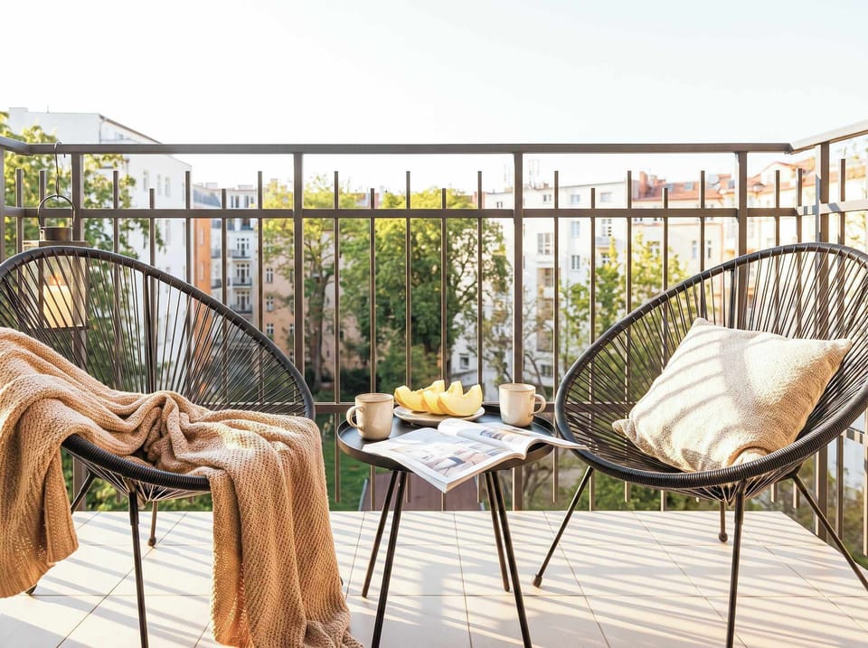 The balcony has an outdoor seating