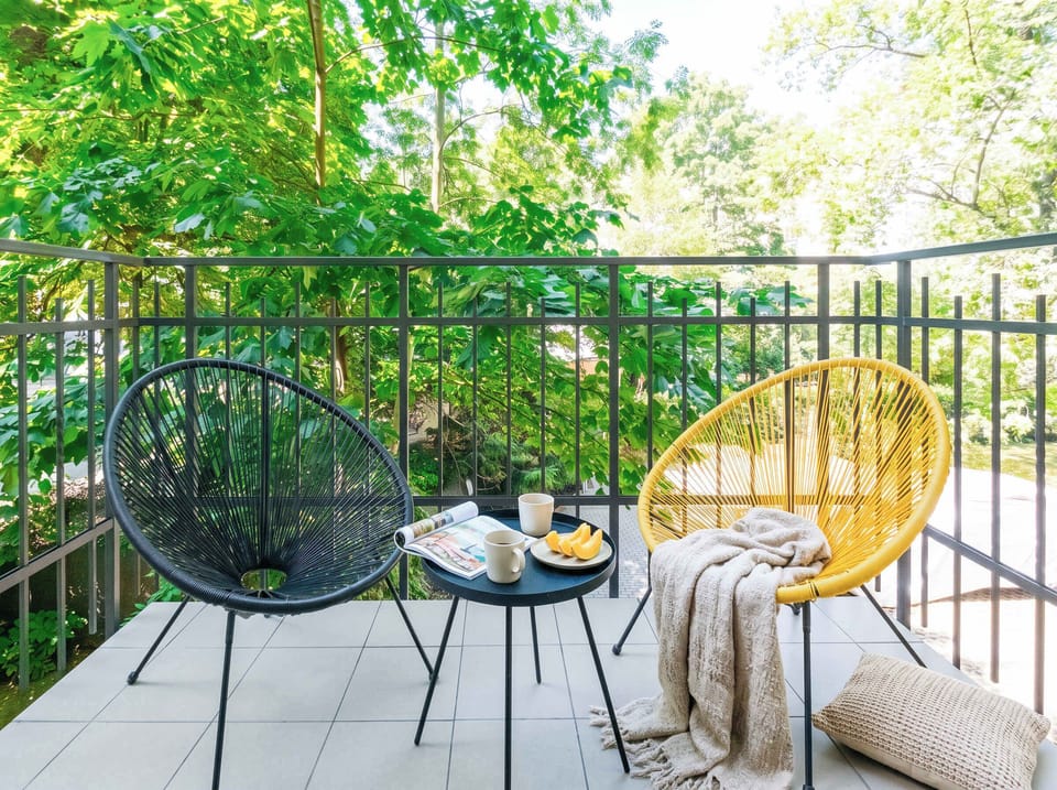 The apartment is in second floor and has a balcony with outdoor seating