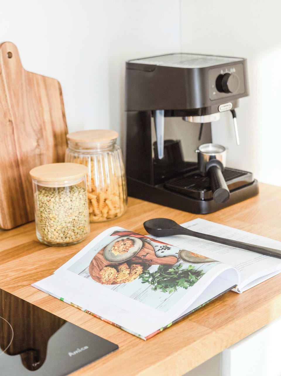 There is a coffee machine in the kitchen