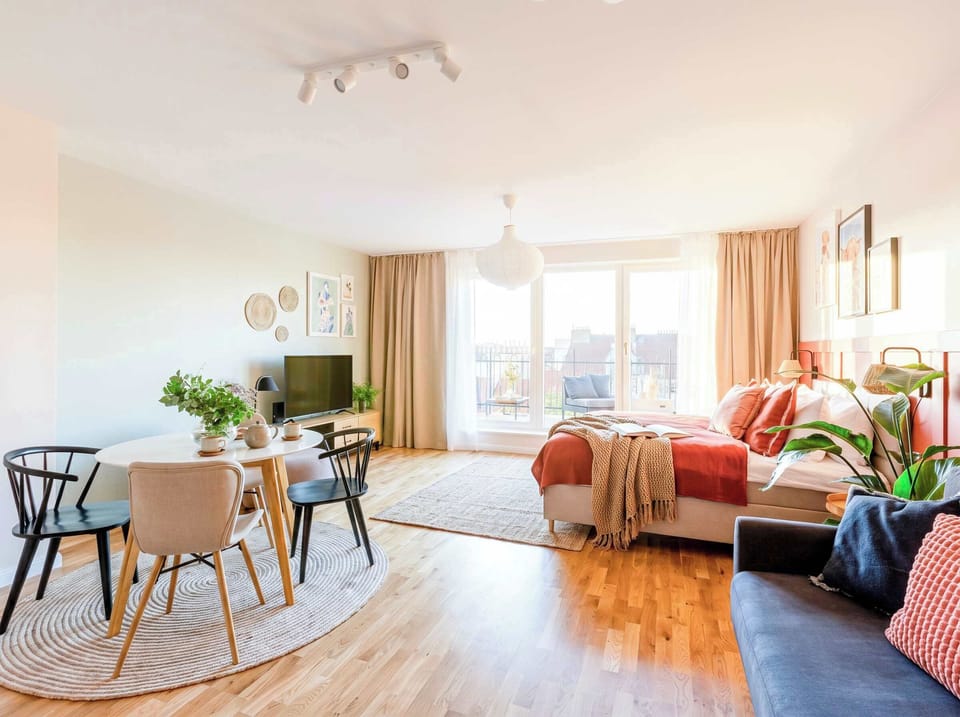 The main room is equipped with queen size bed and convertible sofa
