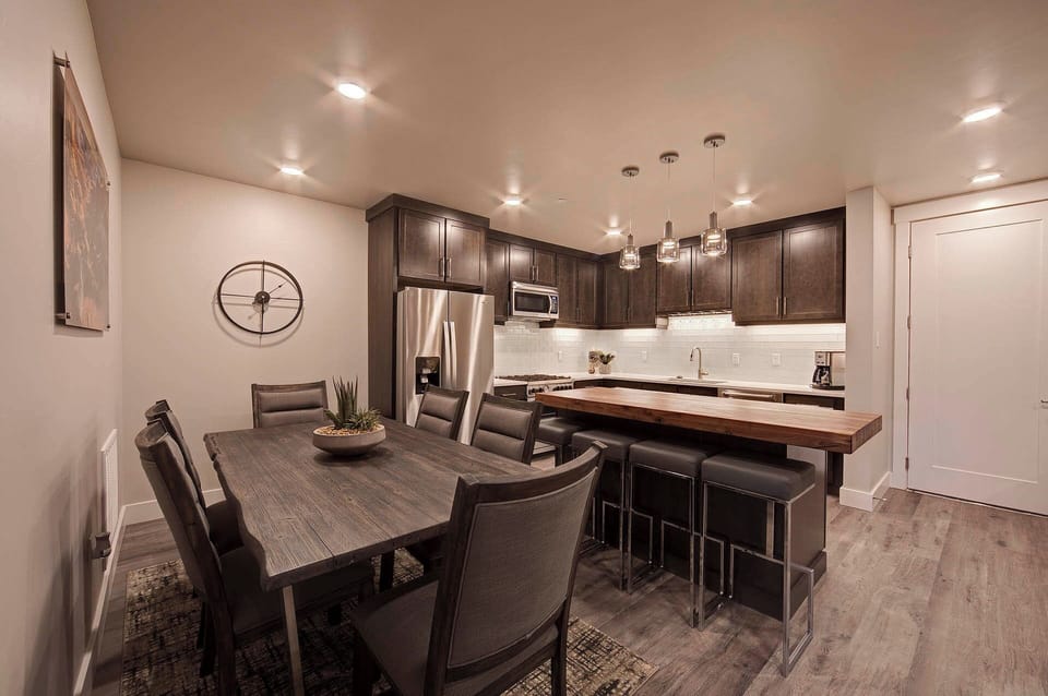 Plenty of seating options available at the dining table or kitchen island. (Photos don't depict actual furnishings in the unit)