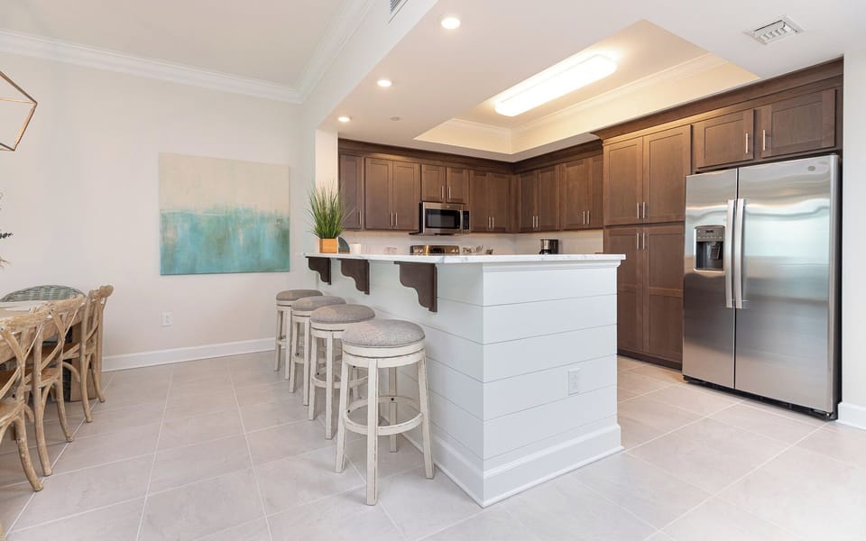 Savor your morning coffee at the breakfast bar to start your day in this inviting space