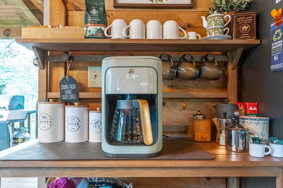 Coffee bar has decaf & regular coffee, creamer, tea, sugar & sugar substitute