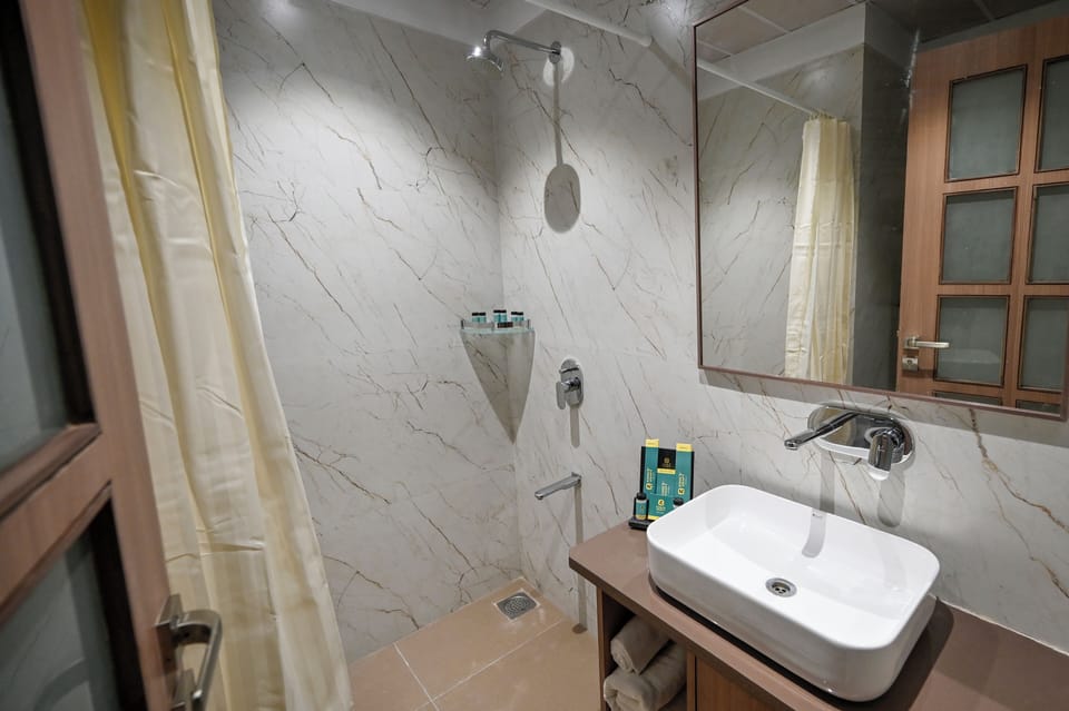 Shower, rainfall showerhead, towels, soap