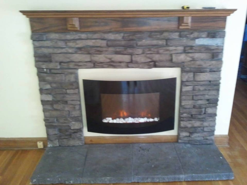 Remote controlled eFireplace with Curved Glass Cover & White Pebble Rock base!
