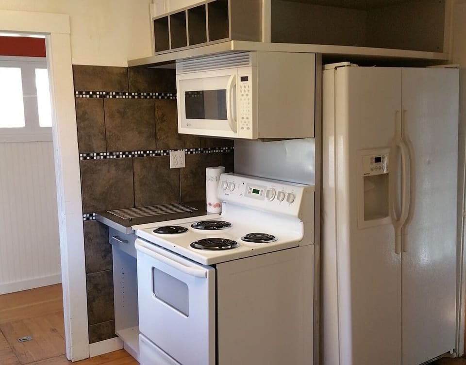 Fully Equipped kitchen includes Cookware & Bakeware + Dishes and Silverware.