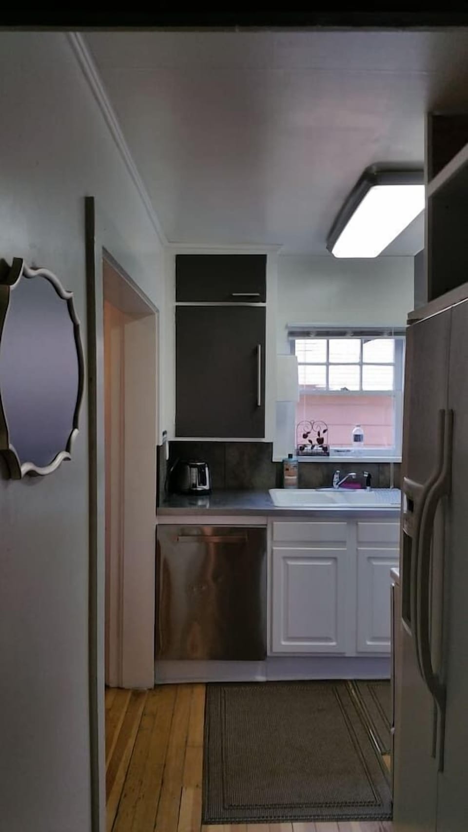 Kitchen has been remodeled and now includes stainless steel countertops, dishwasher plus microhood, range and side by side refrigerator!