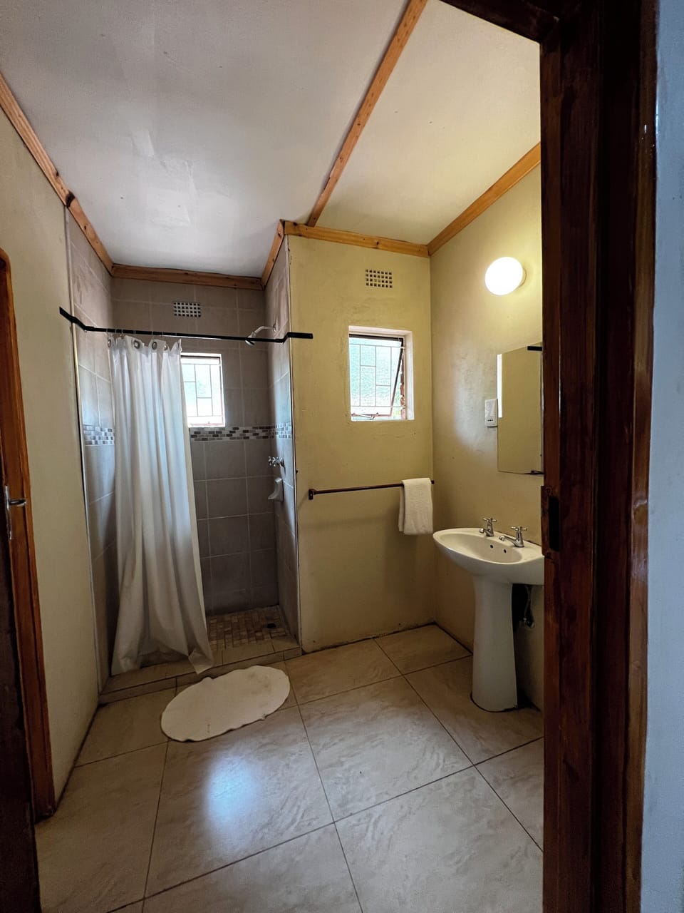 Shower, rainfall showerhead, eco-friendly toiletries, towels