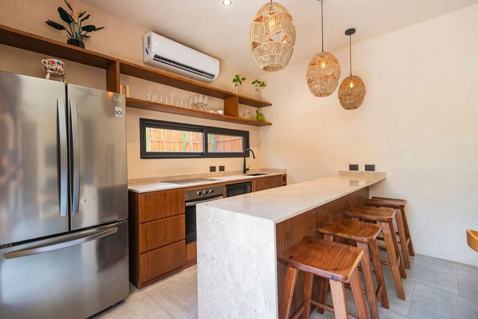 Chic kitchen w/ breakfast bar & woven pendant lights
