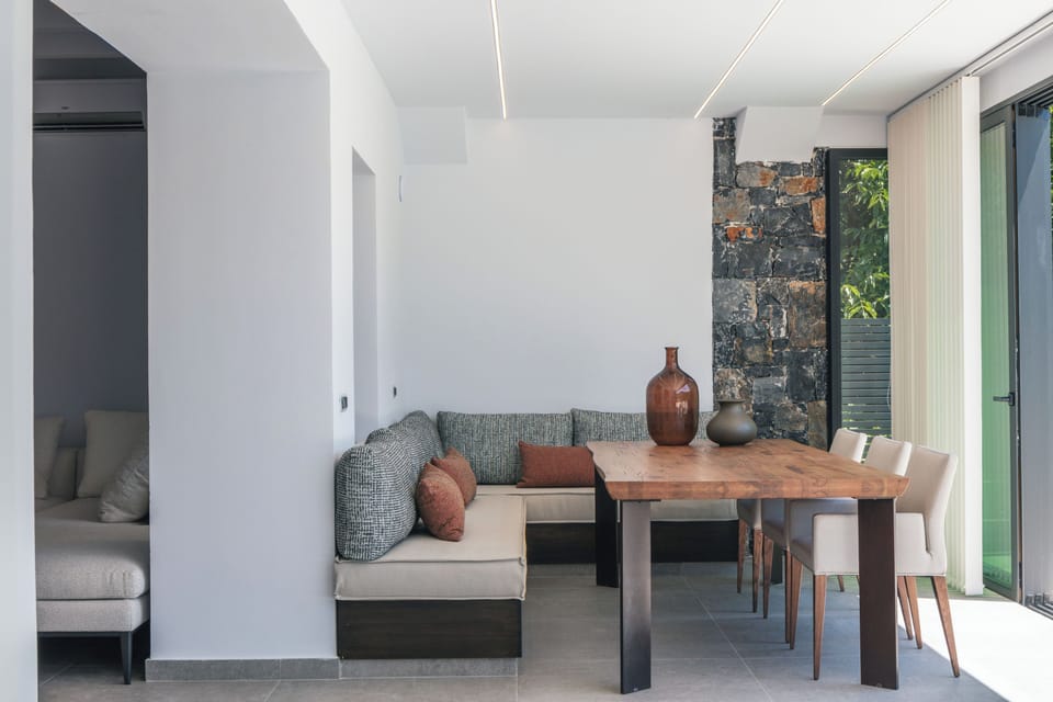 An indoor dining table, complete with a cozy corner seating arrangement!