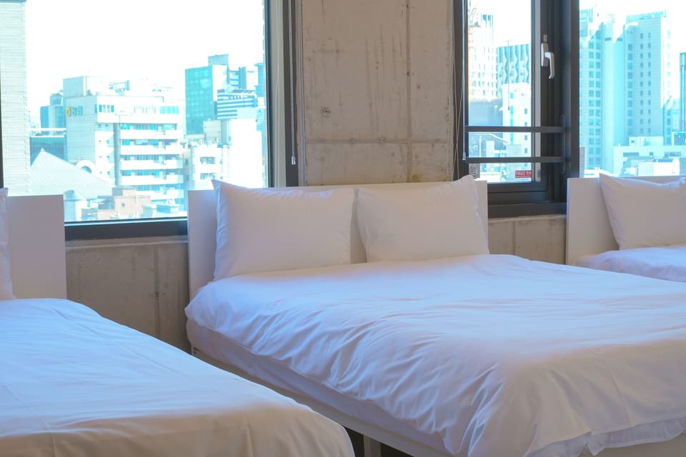 Stitch Deluxe Quadruple | Premium bedding, desk, laptop workspace, soundproofing