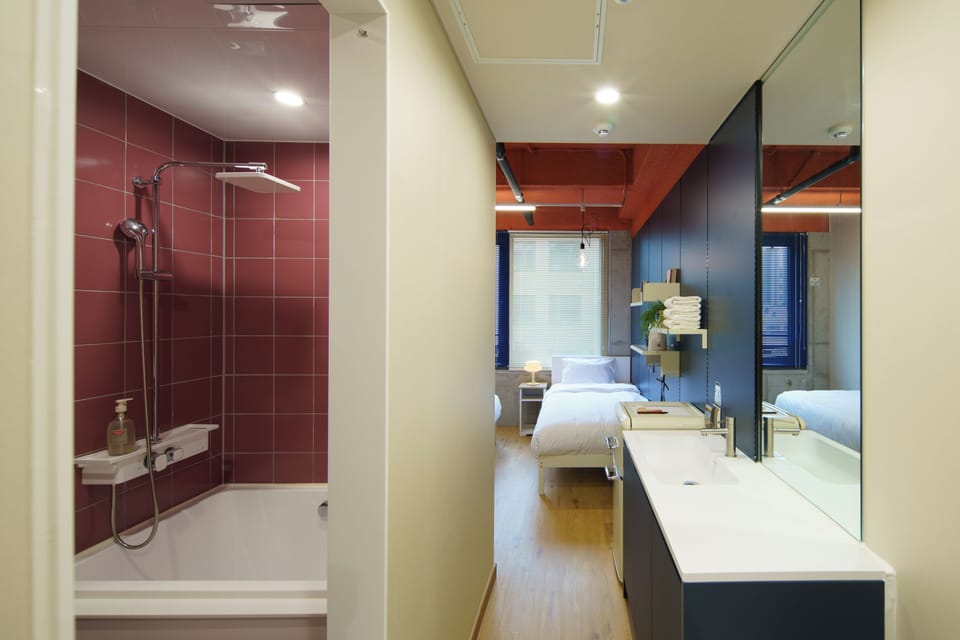 Premium bedding, desk, laptop workspace, soundproofing